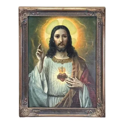 Sale Photo Thumbnail #71: Vintage framed print of the Sacred Heart of Jesus, housed in an ornate, gilded wood frame with corner embellishments.