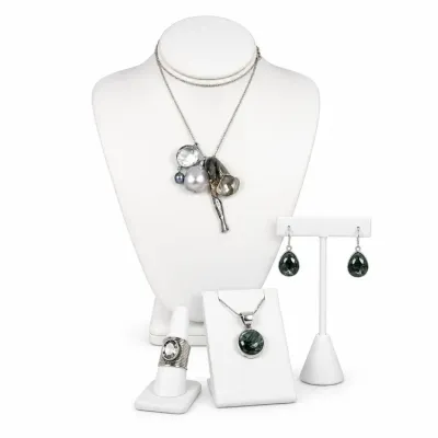 Sale Photo Thumbnail #10: Assorted sterling silver jewelry collection, including a multi-charm pendant necklace, a matching green stone pendant and drop earring set, and a wide band ring with a central clear stone.