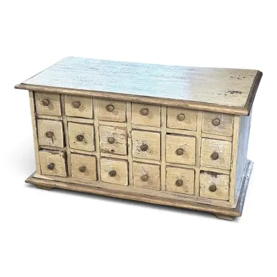 Sale Photo Thumbnail #103: Vintage miniature apothecary chest featuring eighteen small drawers with wooden knobs and a distressed, cream-painted finish.