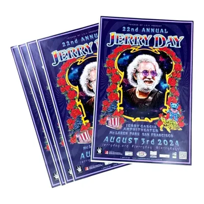Sale Photo Thumbnail #151: Stack of 22nd Annual Jerry Day posters from August 3rd, 2024, featuring psychedelic artwork of Jerry Garcia surrounded by roses, a dancing bear, and a turtle.