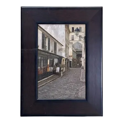 Sale Photo Thumbnail #66: Framed oil painting depicting a Parisian street scene with Cafe Procope, housed in a wide, dark wood frame.