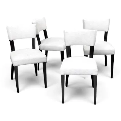 Sale Photo Thumbnail #90: Set of four contemporary dining chairs featuring white upholstered seats and backs paired with dark espresso-finished wooden legs.