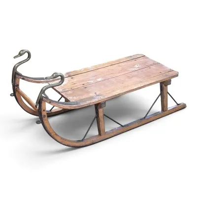 Sale Photo Thumbnail #107: Antique wooden child's sled featuring curved runners tipped with cast metal swan heads.