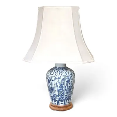 Sale Photo Thumbnail #170: Chinese blue and white porcelain ginger jar table lamp with floral motifs, mounted on a wooden base and topped with a white pagoda-style shade.