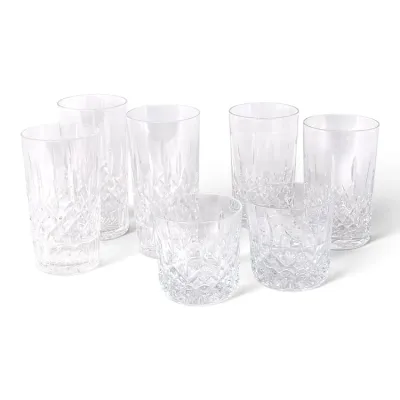 Sale Photo Thumbnail #173: Set of seven cut crystal drinking glasses, including five highball glasses and two double old fashioned glasses, featuring a classic diamond and wedge cut pattern.