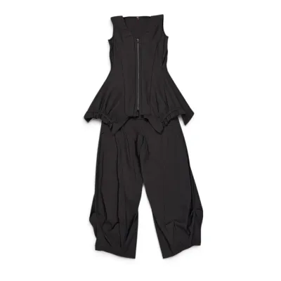 Sale Photo Thumbnail #18: Two-piece black ensemble featuring a sleeveless, zip-front peplum top with structured shoulders and matching wide-leg trousers with draped detailing.