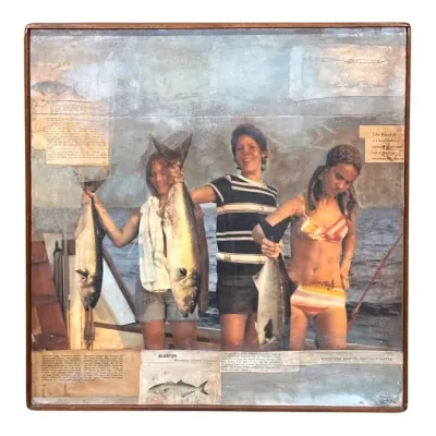 Sale Photo Thumbnail #46: Vintage mixed media collage art piece depicting three women on a boat showing off their fish catch, framed in a simple wood frame.