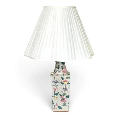 Sale Photo Thumbnail #171: Vintage Chinoiserie ceramic table lamp featuring a hand-painted floral design on a square base, paired with a white pleated fabric shade.