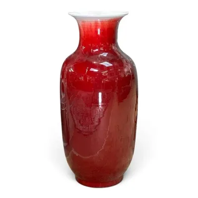 Sale Photo Thumbnail #229: Large Chinese oxblood flambe glazed porcelain vase, featuring a rich red gradient fading to a white rim.
