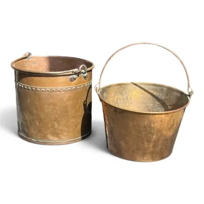 Sale Photo Thumbnail #234: Pair of antique copper buckets with metal bail handles, featuring hammered textures and riveted details.