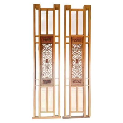 Sale Photo Thumbnail #84: Pair of tall Chinese carved wooden screen panels featuring intricate lattice work and decorative relief panels.