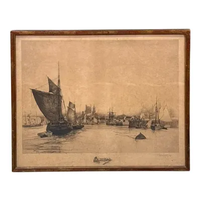 Sale Photo Thumbnail #80: Framed antique etching depicting a harbor scene with sailboats, housed in a simple wooden frame.
