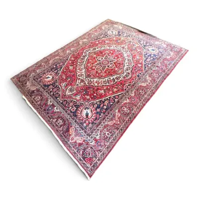 Sale Photo Thumbnail #118: Traditional Persian-style area rug featuring an intricate central medallion design in shades of red, navy blue, and cream.