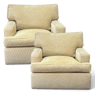 Sale Photo Thumbnail #116: Pair of mid-century modern style swivel club chairs upholstered in a textured beige geometric fabric.