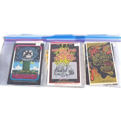 Sale Photo Thumbnail #128: Collection of vintage 1960s psychedelic concert handbills, including advertisements for The Youngbloods, South Side Sound System, and The Who at Fillmore East, preserved in plastic sleeves.