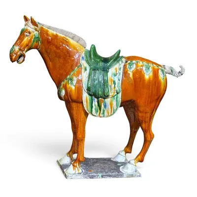 Sale Photo Thumbnail #222: Chinese Tang dynasty style Sancai glazed ceramic horse figure, featuring amber, green, and cream dripped glazes on a rectangular base.