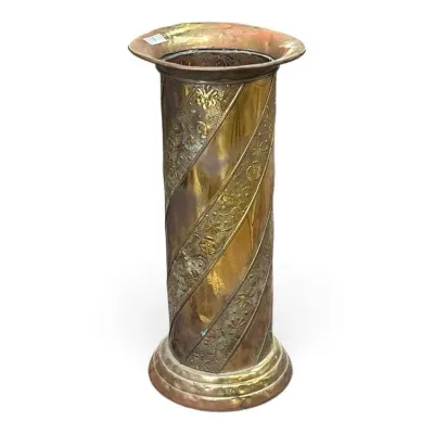 Sale Photo Thumbnail #224: Antique brass and copper umbrella stand featuring a spiral design with embossed floral bands and a flared rim.