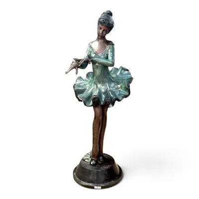 Sale Photo Thumbnail #227: Bronze ballerina statue featuring a green patinated tutu and bodice, standing on a circular black base.