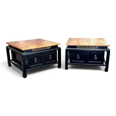 Sale Photo Thumbnail #114: Pair of vintage Asian-style end tables featuring light wood tops, black lacquered bases, fretwork detailing, and two drawers with brass ring pulls.