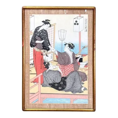 Sale Photo Thumbnail #63: Framed Japanese ukiyo-e woodblock print depicting three figures on a veranda, presented in a gold-toned frame with a textured mat.