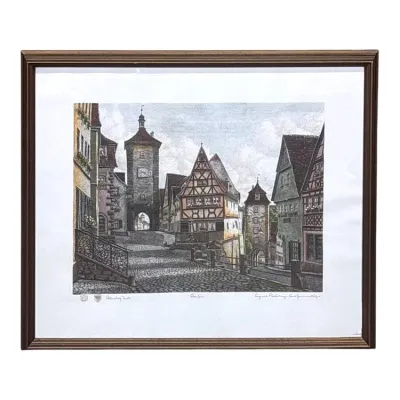 Sale Photo Thumbnail #75: Framed hand-colored etching depicting the Plönlein in Rothenburg ob der Tauber, Germany, signed and titled in pencil along the lower margin.