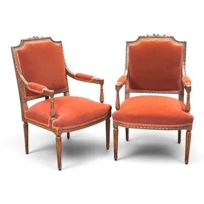 Sale Photo Thumbnail #96: Pair of Louis XVI style armchairs with carved wooden frames and burnt orange velvet upholstery.