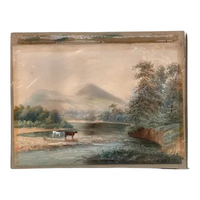 Sale Photo Thumbnail #38: Antique landscape watercolor painting depicting cows watering by a river with mountains in the background, presented on a simple card backing.