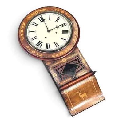 Sale Photo Thumbnail #187: Antique drop-trunk wall clock featuring intricate wood inlay, floral borders, and a stag motif on the lower panel.