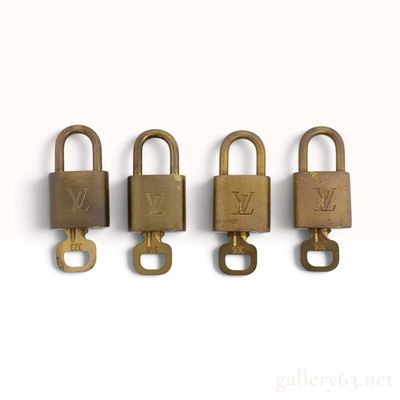 Sale Photo Thumbnail #471: A Group of Four Louis Vuitton Brass Padlocks and Keys