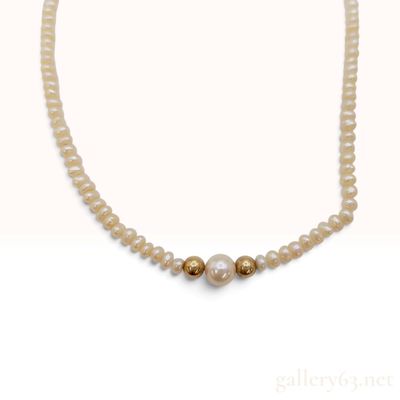 Sale Photo Thumbnail #435: An 18 Karat Yellow Gold and Cultured Pearl Strand Necklace