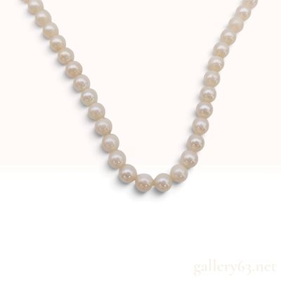 Sale Photo Thumbnail #62: A Graduated Cultured Pearl Strand Necklace with Silver Filigree Clasp