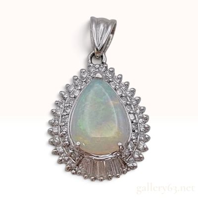 Sale Photo Thumbnail #285: A Platinum 0.76ct Pear Shaped Opal and 0.35ctw Diamond Halo Pendant