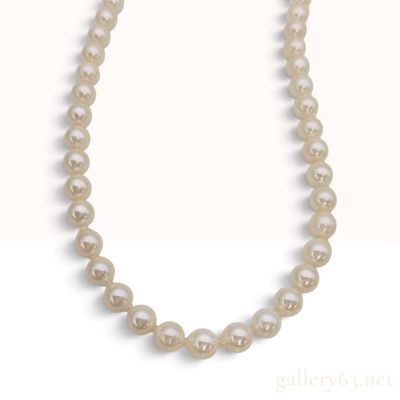 Sale Photo Thumbnail #269: A Graduated Cultured Pearl Necklace with Silver Floral Clasp