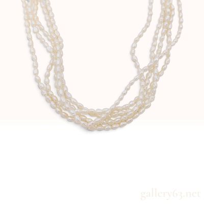 Sale Photo Thumbnail #284: A Five Strand White Freshwater Cultured Baroque Pearl Necklace