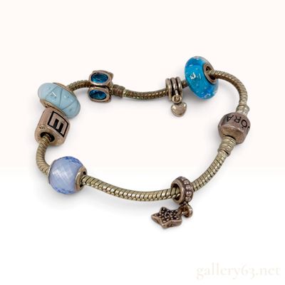 Sale Photo Thumbnail #360: Pandora Sterling Silver Charm Bracelet with Seven Mixed Beads and Charms