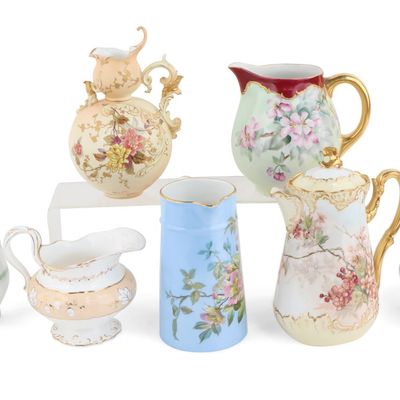 Seven Floral Decorated Porcelain Pitchers