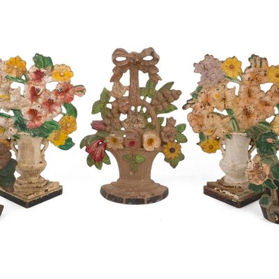 Seven Painted Cast-Iron Flower Basket Doorstops