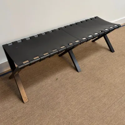 Sale Photo Thumbnail #31: Modernist bench featuring a black leather sling seat woven onto a polished metal X-base frame.