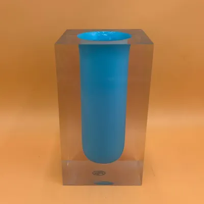 Sale Photo Thumbnail #72: Alessandro Mandruzzato Murano Sommerso art glass vase, featuring a blue core encased in a clear, block-shaped outer layer.
