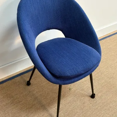 Sale Photo Thumbnail #128: Eero Saarinen style executive conference chair upholstered in textured blue fabric with black metal legs.