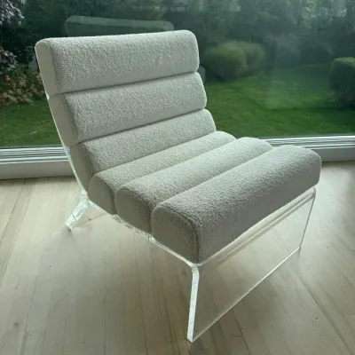 Sale Photo Thumbnail #14: Modern channel-tufted lounge chair featuring white bouclé upholstery on a clear acrylic frame.
