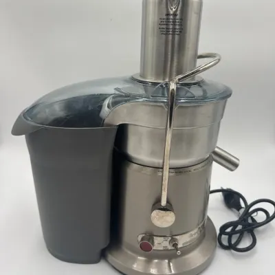 Sale Photo Thumbnail #86: Breville Juice Fountain Elite centrifugal juicer featuring a brushed stainless steel housing, a large feed chute, and a grey plastic pulp container.
