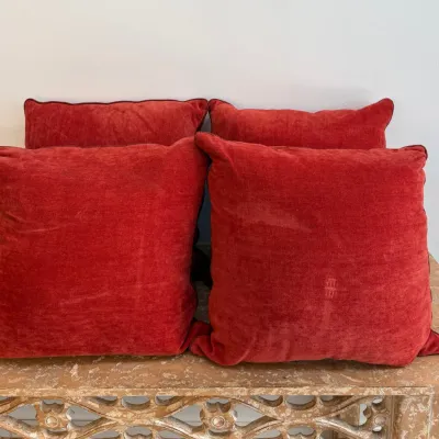 Sale Photo Thumbnail #134: Set of four plush red velvet throw pillows with piped edges, displayed on a carved wooden console table.
