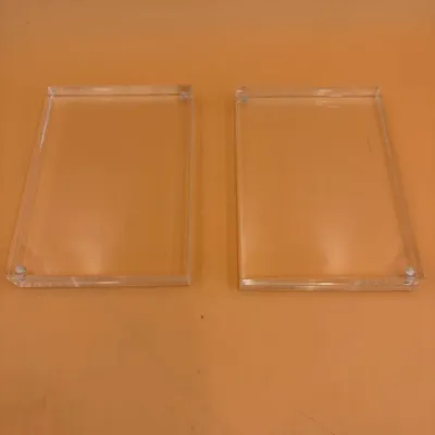 Sale Photo Thumbnail #59: Pair of clear acrylic magnetic photo frames, showing minimal wear.