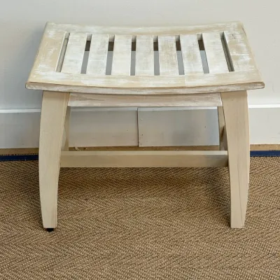 Sale Photo Thumbnail #118: Shabby chic style wooden vanity stool featuring a curved, slatted seat and a distressed white-washed finish.