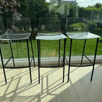 Sale Photo Thumbnail #16: Trio of modern bar stools featuring clear acrylic seats and backs on slender black metal frames.