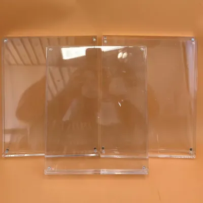 Sale Photo Thumbnail #81: Three clear acrylic magnetic picture frames in varying sizes, showing minor surface wear.