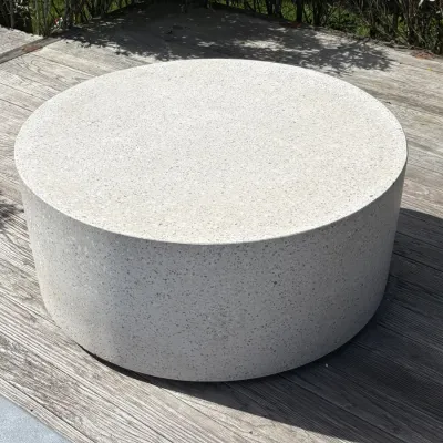 Sale Photo Thumbnail #8: Modern round concrete terrazzo coffee table, featuring a speckled light gray finish, suitable for indoor or outdoor use.