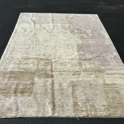 Sale Photo Thumbnail #39: Contemporary area rug featuring an abstract, textured design in neutral tones of beige, cream, and muted lavender.