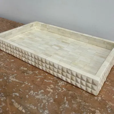 Sale Photo Thumbnail #99: Rectangular bone inlay decorative tray featuring a textured, pyramidal geometric pattern on the exterior walls and a smooth brick-patterned interior.